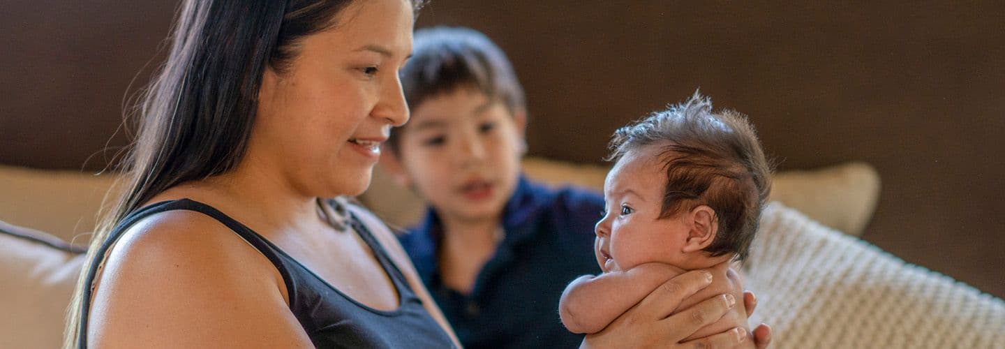 a young mother holds her child