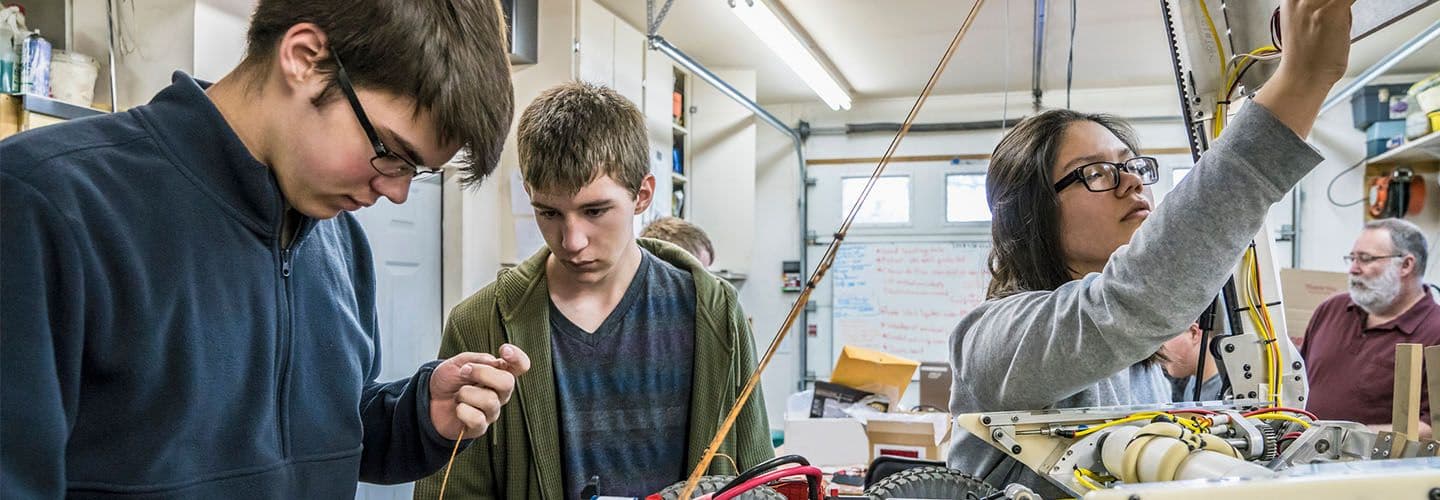 students learn to work with machinery