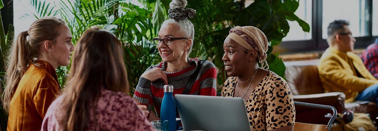 a group of women have a conversation